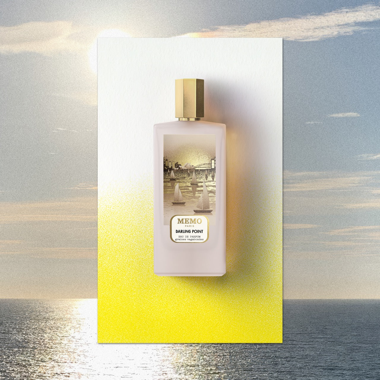 A pale pink rectangular perfume bottle with gold cap and sailboat label by memo paris for darling point australian encounter — vue alternative