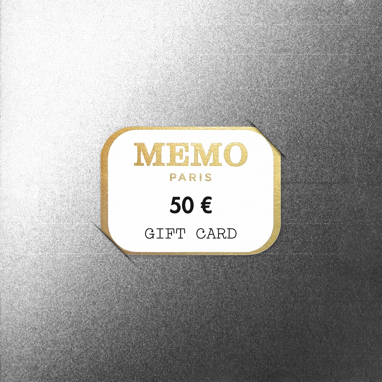 A white and gold memo paris gift card with elegant typography and 50 euro value celebrating dream destinations