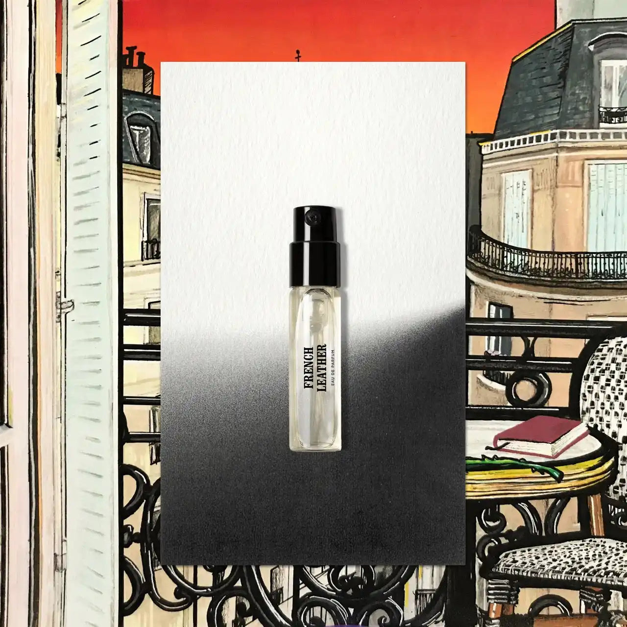 Clear perfume sample with black cap.