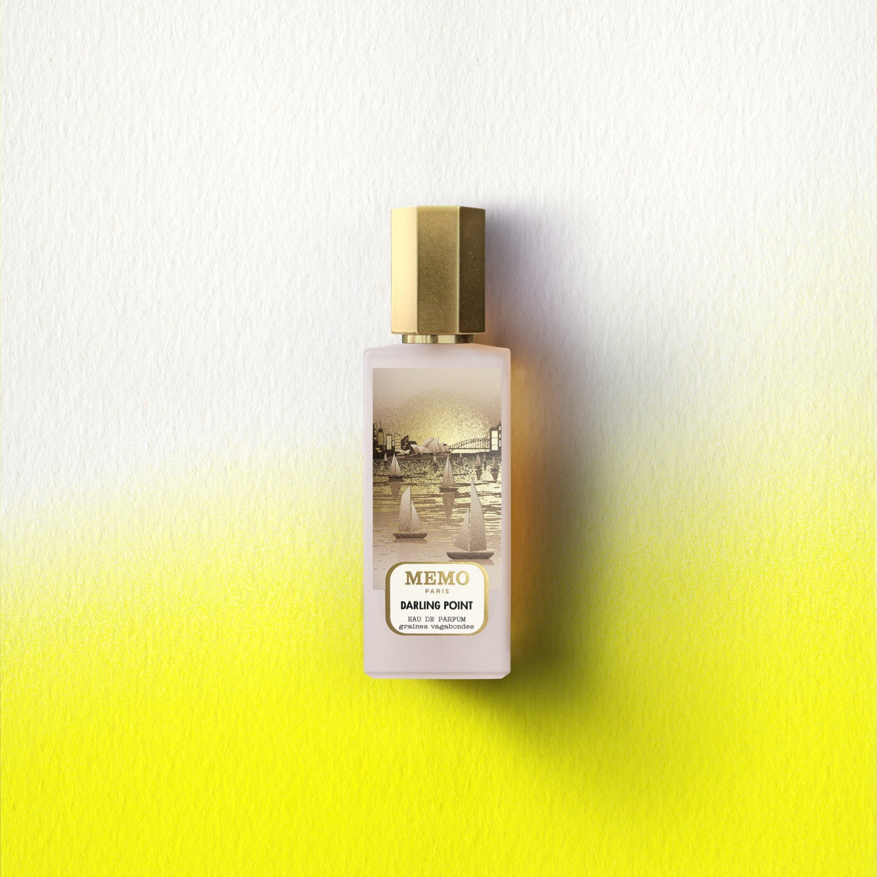 A sleek darling point eau perfume bottle with frosted glass and gold cap featuring sailboats on water illustration