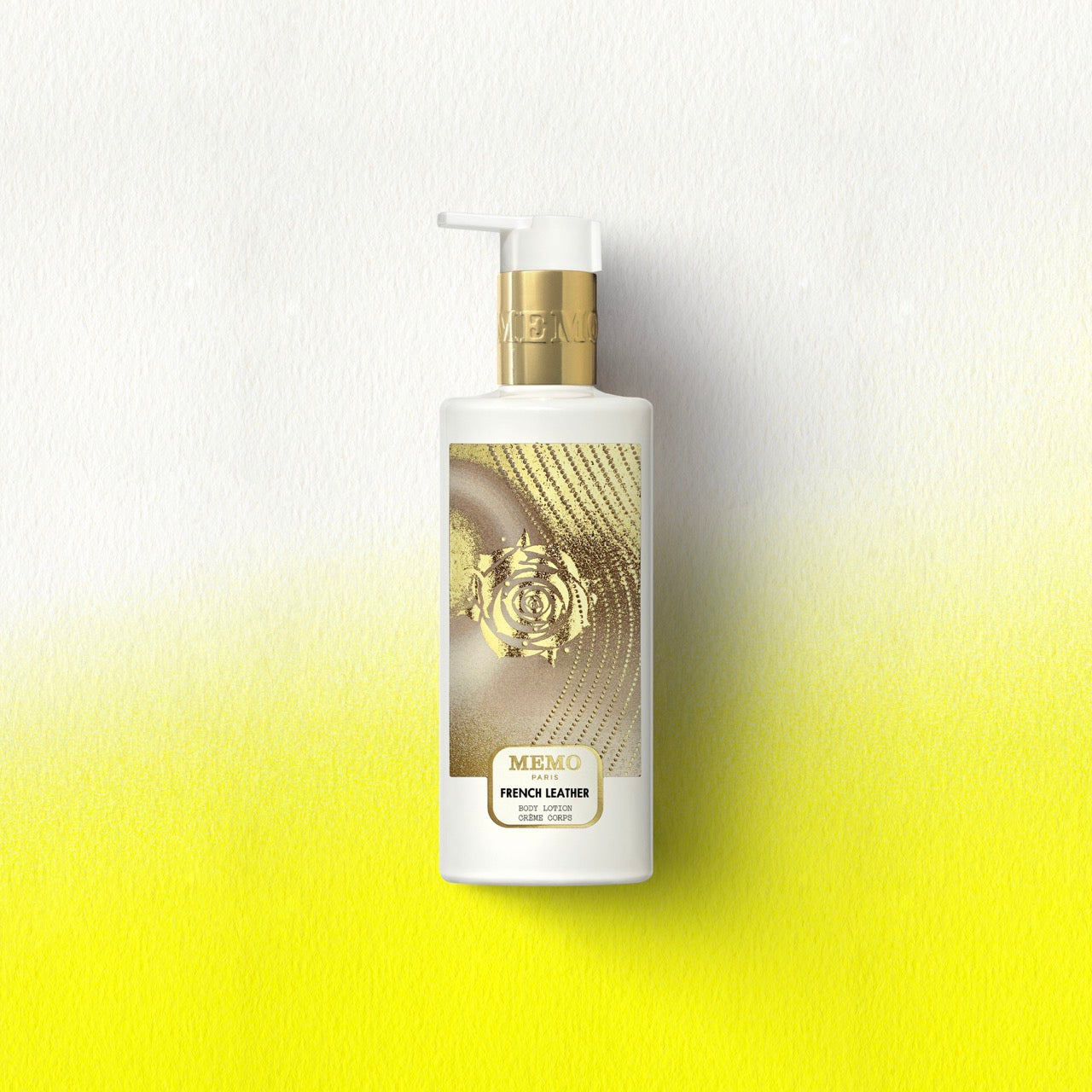 White bottle of memo paris french leather body lotion with gold pump and rose design label for skincare use