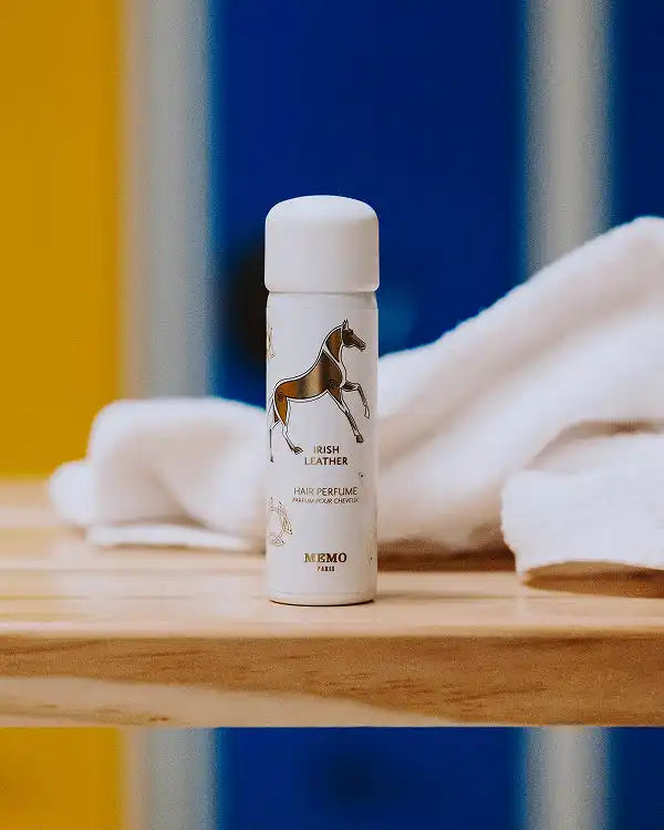 White perfume bottle with horse design.